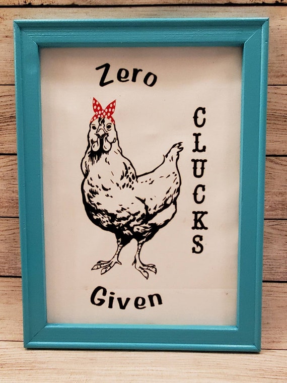 12×18 inch canvas with teal wood frame with a chicken wearing  a red bandana and the phrase Zero Clucks Given