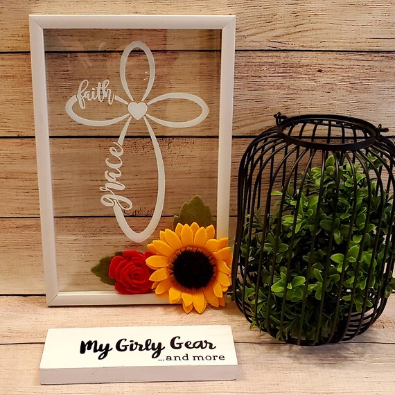Cross sign with felt sunflower and small red rose White framed glass sign with cross and the words Faith and Grace and a heart in the center