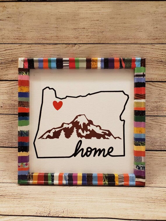 12×12 in magazine wrapped framed canvas with a picture of Oregon with a mountain  and a heart in the Portland Oregon area.