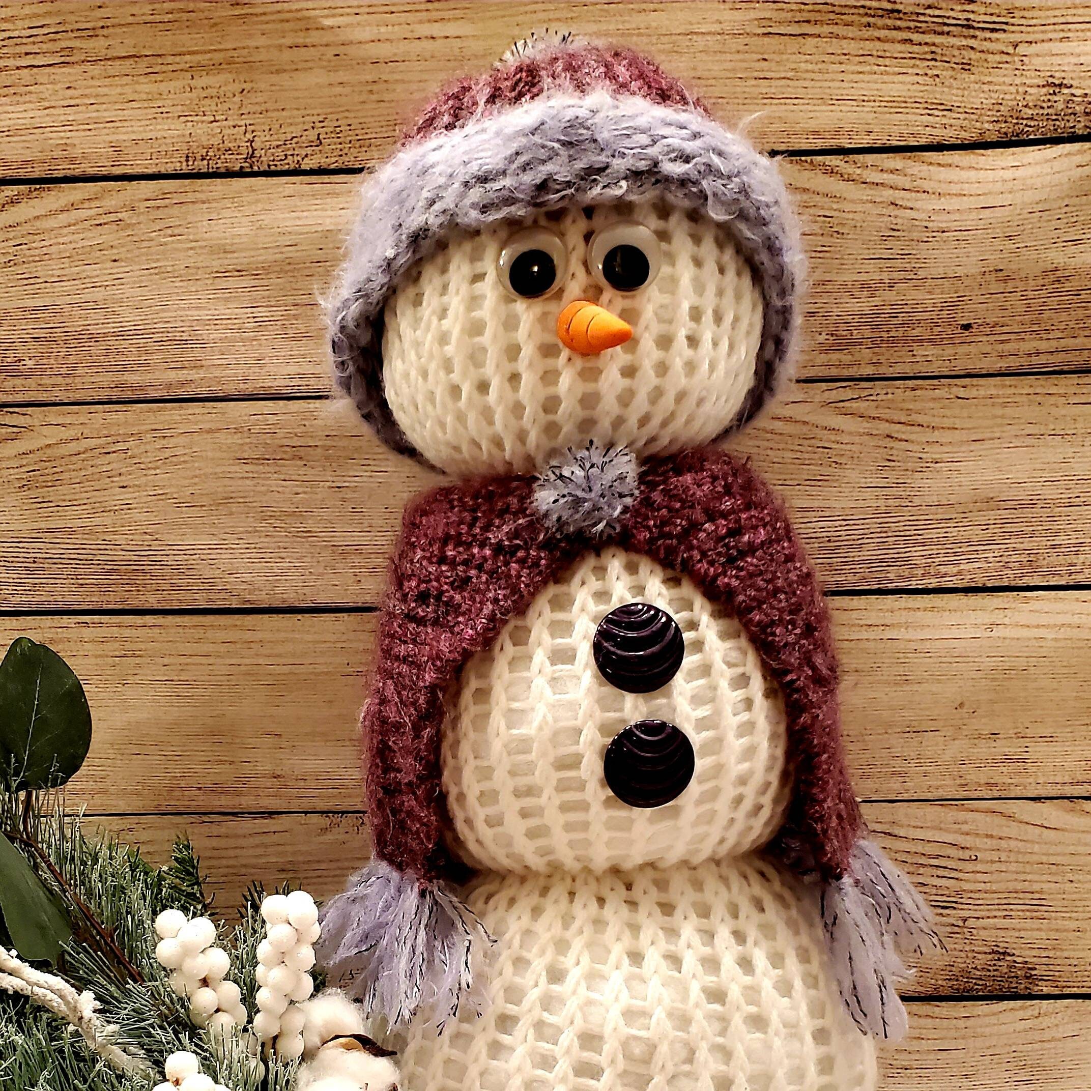 Knitted snowman with matching knitted hat and shawl in deep purple and