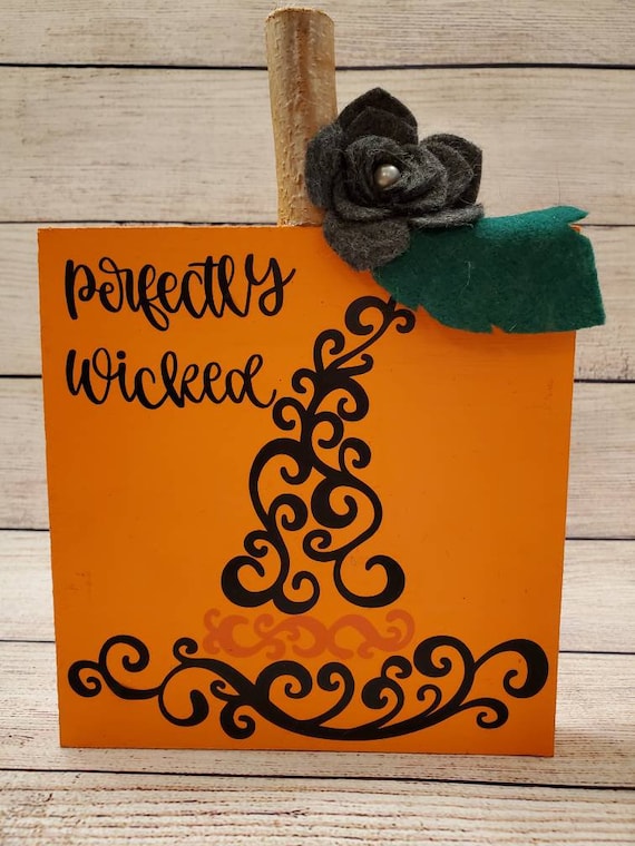 Rustic square wood pumpkin sign handmade felt flower with pearl and branch stump Perfectly Wicked and a swirly witches hat is on the front