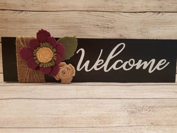 Wood welcome sign in chalkboard black with handmade burgundy and tan felt flowers and green leaf with burlap and twine