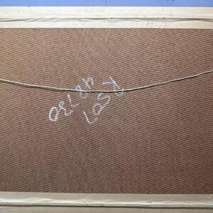 May include: A brown wooden frame with a light brown mat and a white string attached to the top. The text "or Lynn Last" is written in white on the mat.