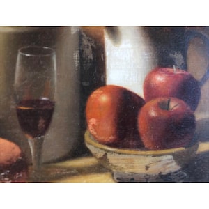 May include: Still life painting featuring a wine glass filled with red liquid, a ceramic pitcher, and a bowl of red apples. The apples are the focal point, with their vibrant color contrasting against the neutral background.