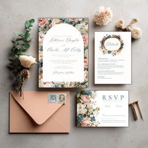 May include: A wedding stationery set with floral patterns in pink, blue, and white. The set includes an invitation, details card, RSVP card, and an envelope with stamps. The invitation features the names "Katherine Douglas" and "Charles Mc Carthy".