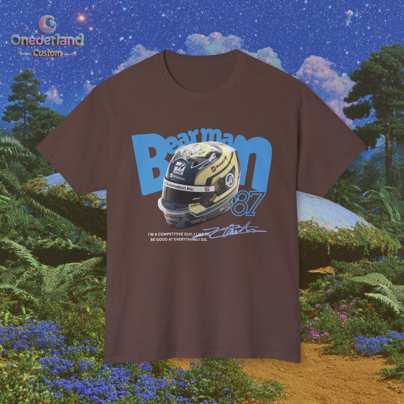 Gear up for Grand Prix weekend with our Oliver Bearman 87 T-shirt. The image clearly displays the vintage-inspired design, highlighting Bearman's signature helmet and number, making it a stylish statement piece for any fan. This premium cotton shirt is a must-have for the Haas faithful. It's an ideal choice for everyday wear, watching the race, or as a thoughtful gift for a fellow motorsport lover who supports Oliver Bearman.