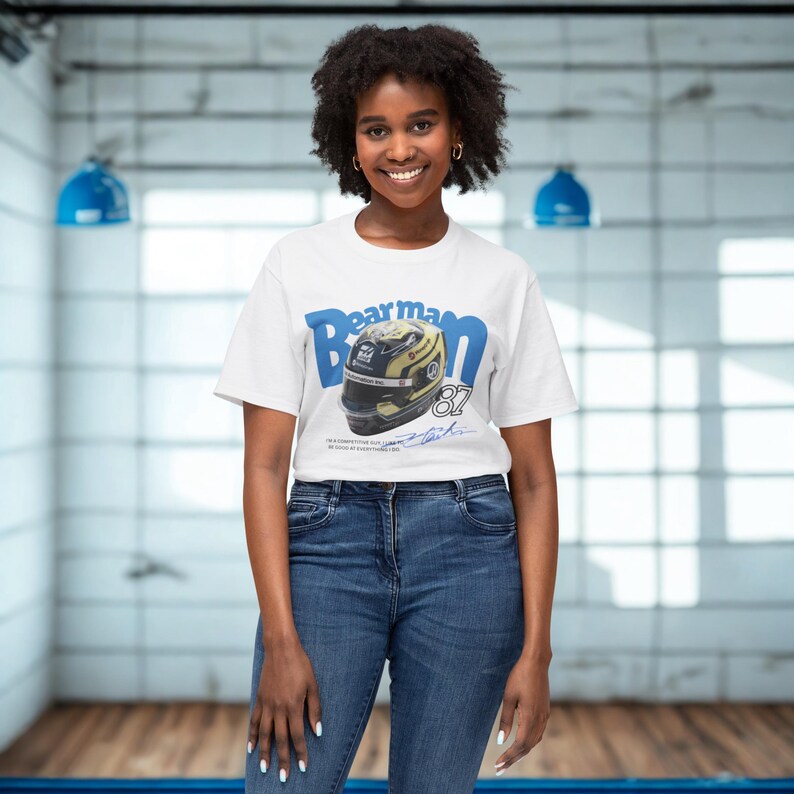 Searching for the perfect gift for an F1 aficionado? Look no further. Our Oliver Bearman T-shirt, featuring a sharp graphic of his helmet and racing number '87' as shown, is a thoughtful and stylish choice. This high-quality cotton shirt combines comfort and fandom, making it an excellent piece for everyday wear or a special occasion. It's a cool and authentic way to share your love for Formula 1, Haas, and Oliver Bearman.