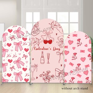 May include: Three arch-shaped backdrops with Valentine's Day designs. The designs include hearts, bows, cherubs, and the text "Galentine's Day." The backdrops are pink and white with red accents. The text "without arch stand" is at the bottom.