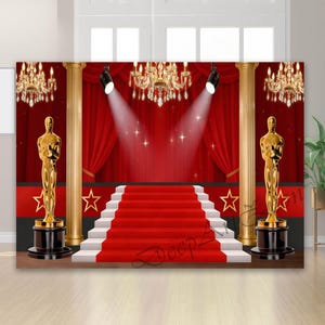 May include: A red carpet backdrop with a stage, stairs, and gold statues. The scene includes red curtains, spotlights, and chandeliers, creating a glamorous, awards show theme. The backdrop features gold columns and star accents.