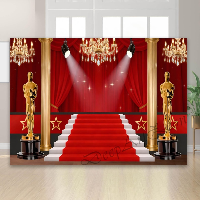 May include: A red carpet backdrop with a stage, stairs, and gold statues. The scene includes red curtains, spotlights, and chandeliers, creating a glamorous, awards show theme. The backdrop features gold columns and star accents.