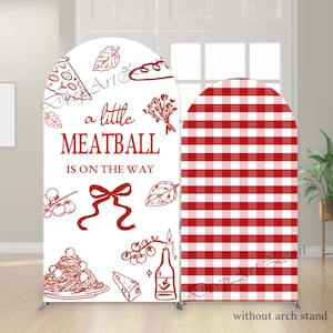 May include: A white arch-shaped backdrop with red text and illustrations, including the phrase "a little MEATBALL IS ON THE WAY." The right side features a red and white checkered pattern. The words "without arch stand" are at the bottom.