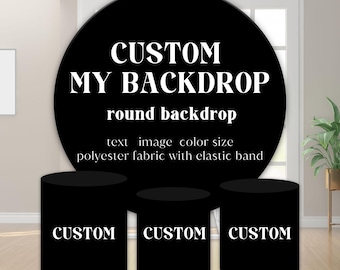 May include: A black round backdrop with the text "CUSTOM MY BACKDROP" and "round backdrop". The image also shows three black cylindrical stands with the word "CUSTOM" on each. The backdrop is made of polyester fabric with an elastic band.