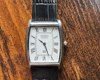 Vintage Rare Seiko Men Slim Tank Quartz White Dial Black Leather Strap Dress Watch
