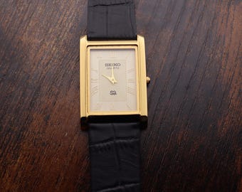 Raro reloj Seiko Slim Tank vintage para hombre, esfera blanca, correa negra, reloj de vestir formal