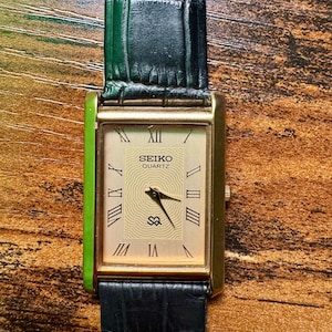 Rare Vintage Seiko Slim tank Men Gold Dial Black Strap Formal Dress watch