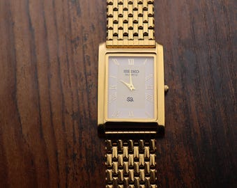 Zeldzame vintage Seiko slanke tank heren witte wijzerplaat GOUD herenpolshorloge