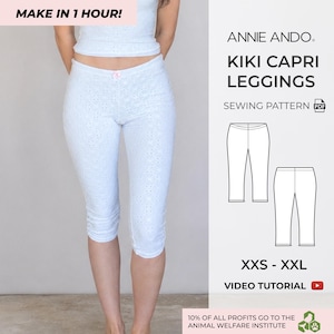 Può includere: Leggings capri bianchi in pizzo con un piccolo fiocco rosa al centro della vita. Il testo recita: MAKE IN 1 HOUR!, ANNIE ANDO, KIKI CAPRI LEGGINGS, SEWING PATTERN PDF, XXS - XXL, VIDEO TUTORIAL, 10% OF ALL PROFITS GO TO THE ANIMAL WELFARE INSTITUTE.
