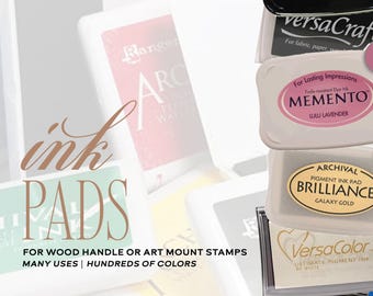 May include: A collection of rectangular ink pads for stamps, featuring various brands including StazOn, VersaCraft, Memento in Lulu Lavender, Brilliance in Galaxy Gold, and VersaColor. The text reads ink PADS FOR WOOD HANDLE OR ART MOUNT STAMPS MANY USES | HUNDREDS OF COLORS.