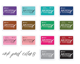 May include: A collection of 12 ink pads in various colors, including black, white, gray, brown, green, blue, pink, red, and teal. Each pad features the text "Ranger Archival Ink" and a small feather icon.