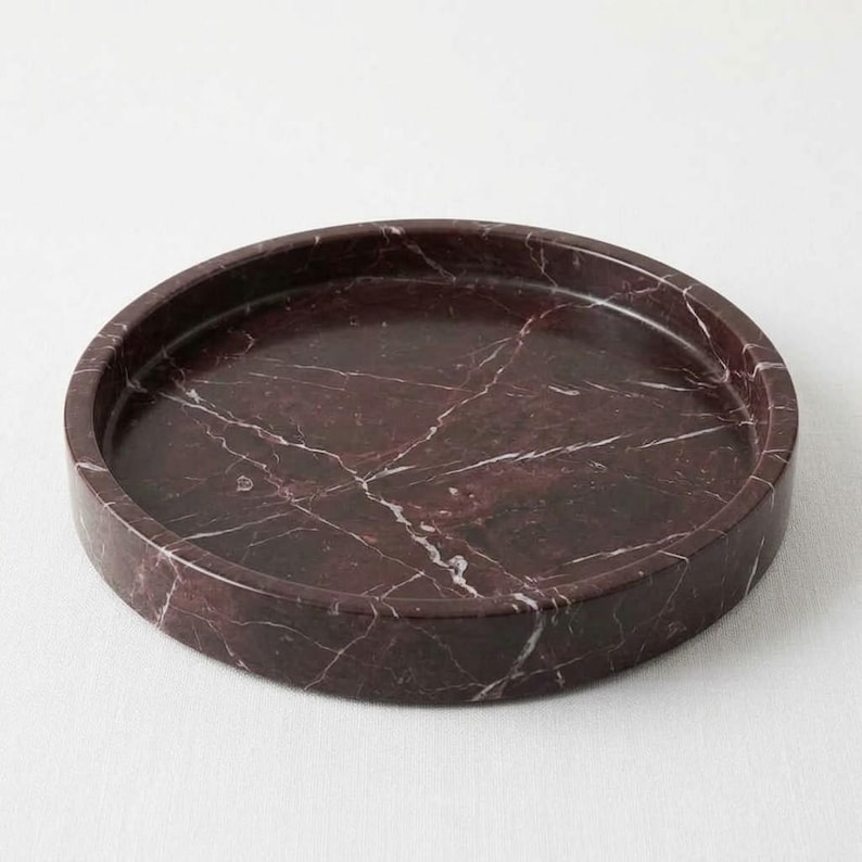 Round rosso levanto marble tray with raised rim on white background