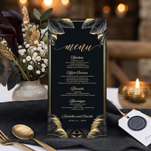May include: A rectangular menu card with a black background, gold border, and gold tropical leaf illustrations at the top and bottom. The text includes "Menu," "Starters," "Main Courses," "Desserts," "Beverages," and "Isabella and Charlie June 19, 2025."