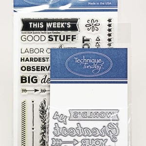Op de afbeelding: Transparante stempels en stansen voor knutselen. De stempels bevatten zinnen zoals "This Week's Good Stuff", "Labor of Love", "Hardest Working", "Observing" en "Big Deal". De stansen bevatten de zin "World's Greatest" en een pijl.