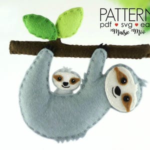May include: A felt sloth pattern with a baby sloth hanging on to its mom. The pattern is available in PDF and SVG formats and is labeled as easy. The pattern is by Maisie Moo.