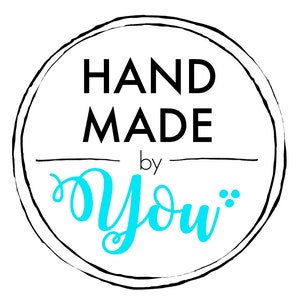 May include: A black and white circle with the text "HAND MADE by YOU" in a white circle with a blue cursive "YOU" in the center.