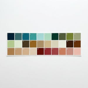 May include: A colour palette card featuring 30 colour swatches in various shades. The colours range from deep navy and teal to soft pastels and rich earth tones. Each swatch is numbered for easy reference, with a white border.