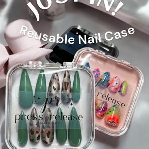 May include: Two clear plastic reusable nail cases with press-on nails. One case has green and brown leopard print nails. The other case has colorful, abstract designs. The text "press release nail art" is on the case with the leopard print nails. The text "release art" is on the case with the abstract designs.