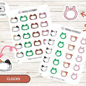 May include: A sheet of stickers featuring various clock designs. The stickers are white with black outlines and feature different colors and patterns. The designs include a cat, a frog, a bunny, and a clock with a clock face. The text "TOFUFAA STATIONERY" is printed on the sheet.