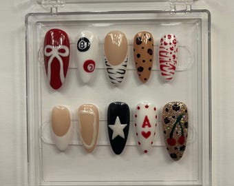 Cute Y2K/casino medium almond nails.
