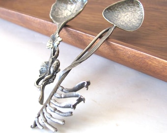 Small collectible spoons, lot of 2, one sterling Harris & Son kangaroo paw flower