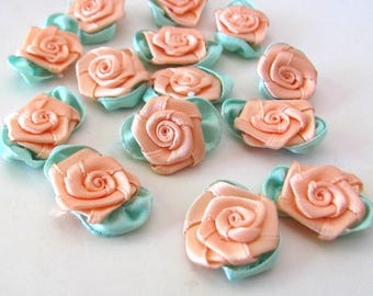 Vintage ribbon roses in a peach satin, 14 handmade little flowers for embellishing costumes, dressmaking, doll clothes, millinery hatmaking