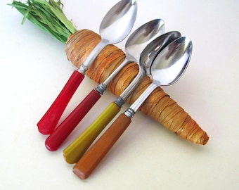 Bakelite spoons, 4 pieces with assorted, red, butterscotch handles