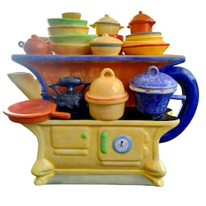 May include: A yellow ceramic teapot shaped like a vintage stove with a blue handle and a clock face on the front. The stovetop has a variety of colorful ceramic pots, pans, and lids.