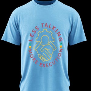 May include: Light blue t-shirt with a circular graphic. The graphic features a yellow gear and handshake design, with the words "LESS TALKING" and "MORE EXECUTION" in a red, curved font. The shirt is a short-sleeved crew neck.