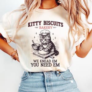 Comfort Colors® Funny Kitty Biscuits Bakery Shirt, We Knead Em You Knead Em Shirt, Cute Cat Baking Shirt, Cat Owner Tee,Humorous Bakery Cat