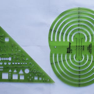 May include: Two translucent lime green plastic drafting templates. The triangular template is labeled Berol RapiDesign R-275 Electro Master. The circular template is labeled Berol RapiDesign R-127 Civil Engineers Radius Guide with various cutouts.