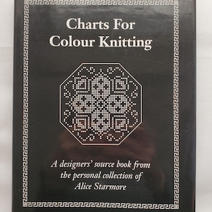 May include: A black book titled "Charts For Colour Knitting" with white text and a geometric design. The book cover also includes the text "A designers' source book from the personal collection of Alice Starmore."