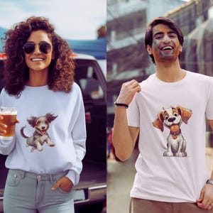 May include: A woman wearing a white sweatshirt and a man wearing a white t-shirt, both featuring a cartoon dog graphic. The dog has brown and tan fur, a red collar, and a happy expression. The woman is holding a glass of beer.