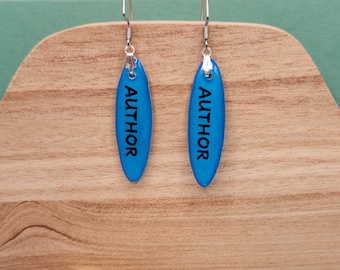 Handcrafted Author Earrings: Blue Resin Dangles with Silver Accents