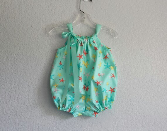 baby in starfish suit