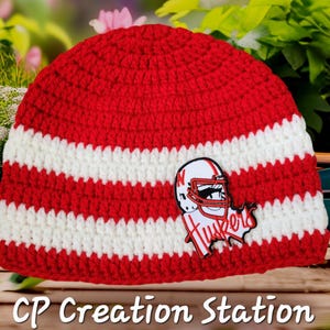 May include: Red and white striped crocheted beanie with a red and white football player applique with the word "Huskies" on it.