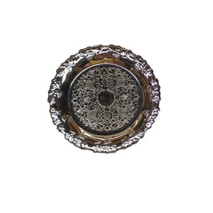 May include: A silver decorative tray with an ornate design. The tray has a raised rim and a smooth surface.