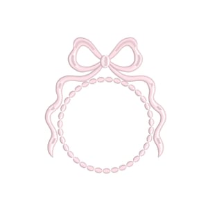 May include: A light pink embroidered design featuring a bow at the top and a circle of pearls. The design has a delicate, feminine aesthetic, perfect for embellishing apparel or accessories.