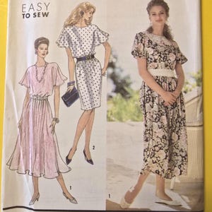 May include: Simplicity sewing pattern 7324, size L5 (12-20). The cover features illustrations of three dresses with different designs. The text "EASY TO SEW" is displayed prominently. The pattern is by Angel Patterns.