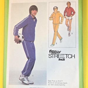 May include: Simplicity 8808 sewing pattern for teen boys. The pattern features a track suit with white stripes, a soccer ball, and illustrations of the finished garments. The package is green and yellow.