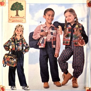 May include: A Simplicity sewing pattern envelope for children's clothing, labeled size BB 5, 6, 7, 8. The cover features illustrations of three children wearing various outfits including pants, shirts, vests, and a backpack, with the Appletree logo.