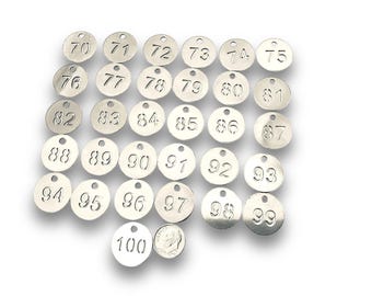 May include: A collection of silver-colored, circular tags, each engraved with a number from 70 to 100. The tags have a small hole at the top for attachment. A dime is next to the tag numbered 100.